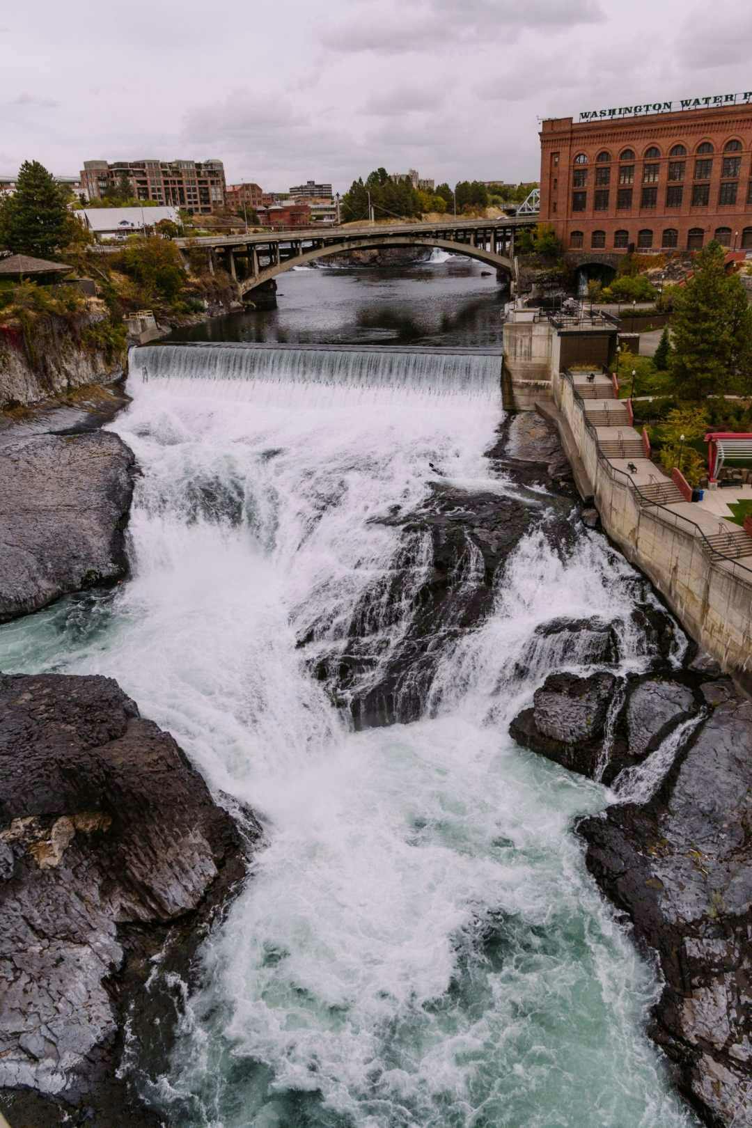A bridge and man-made waterfall in Spokane
