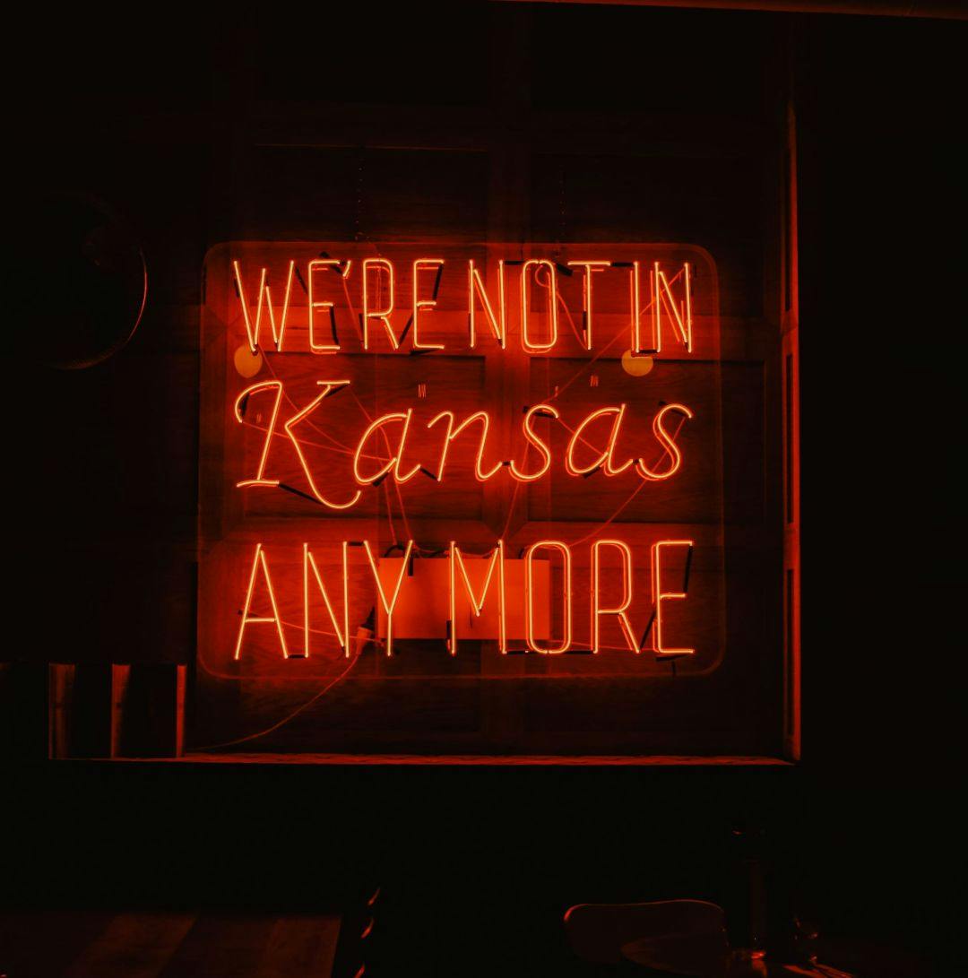 A neon sign that reads we're not in Kansas anymore