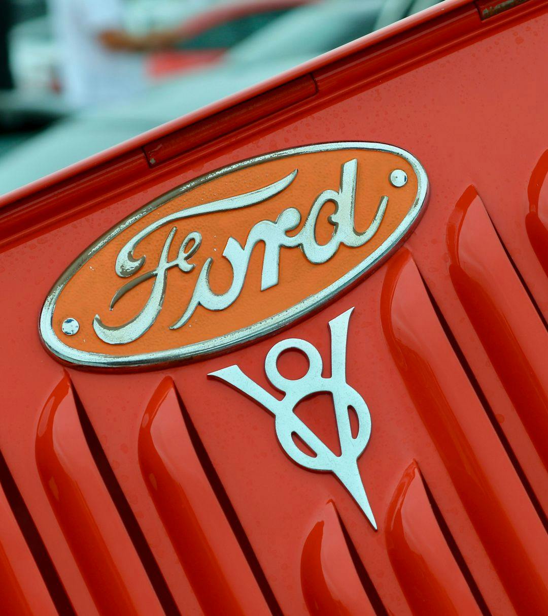 The Ford V8 logo on the back of a pickup truck